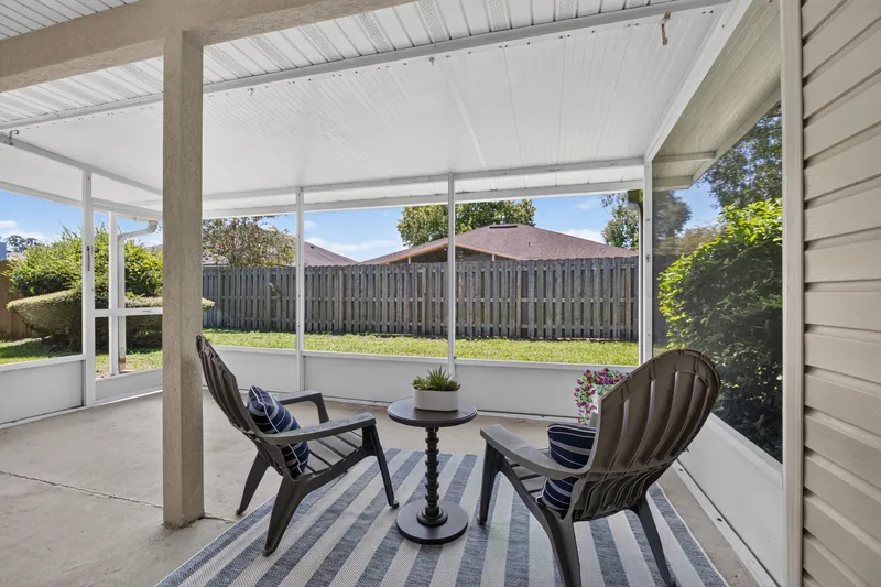 Screened patio with seating
