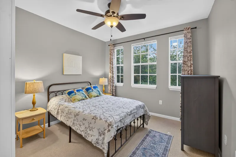 Bright bedroom with tall windows