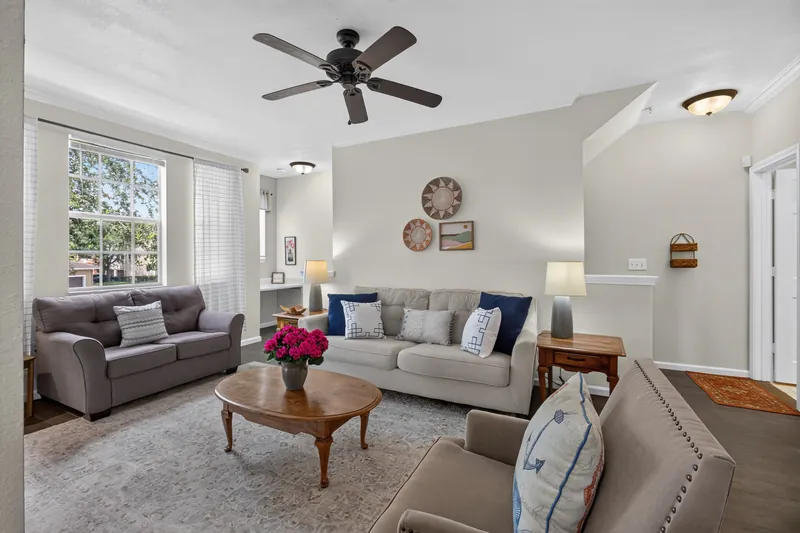 Furnished living room with ceiling fan