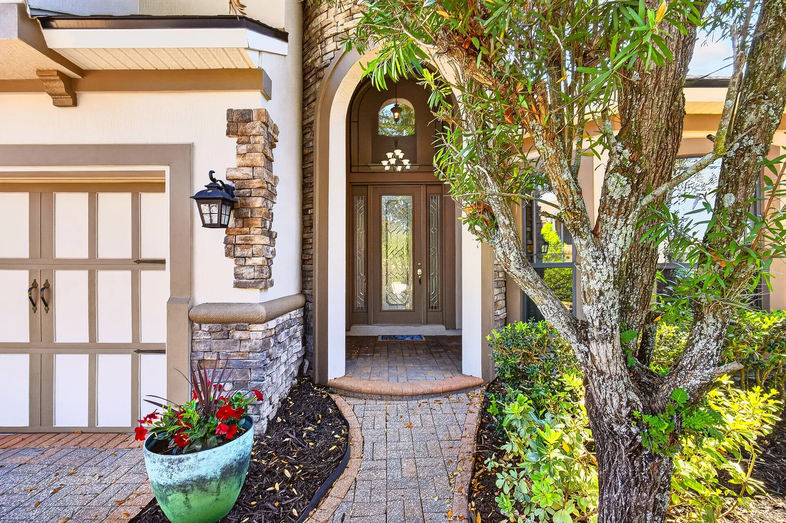 Arched front entry with glass door