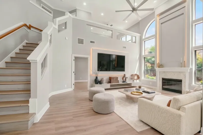 Family room with staircase, virtually staged